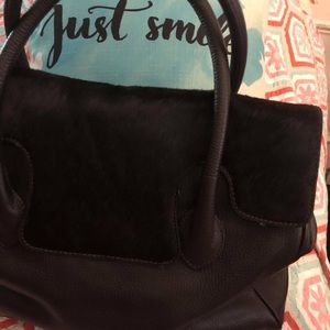 Leather and black horse hair or cow hide